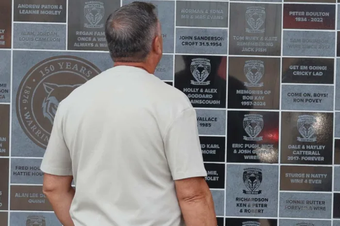 A fan takes a closer look at the Warrington Wolves 150th Anniversary Wall